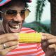 African American man eating corn