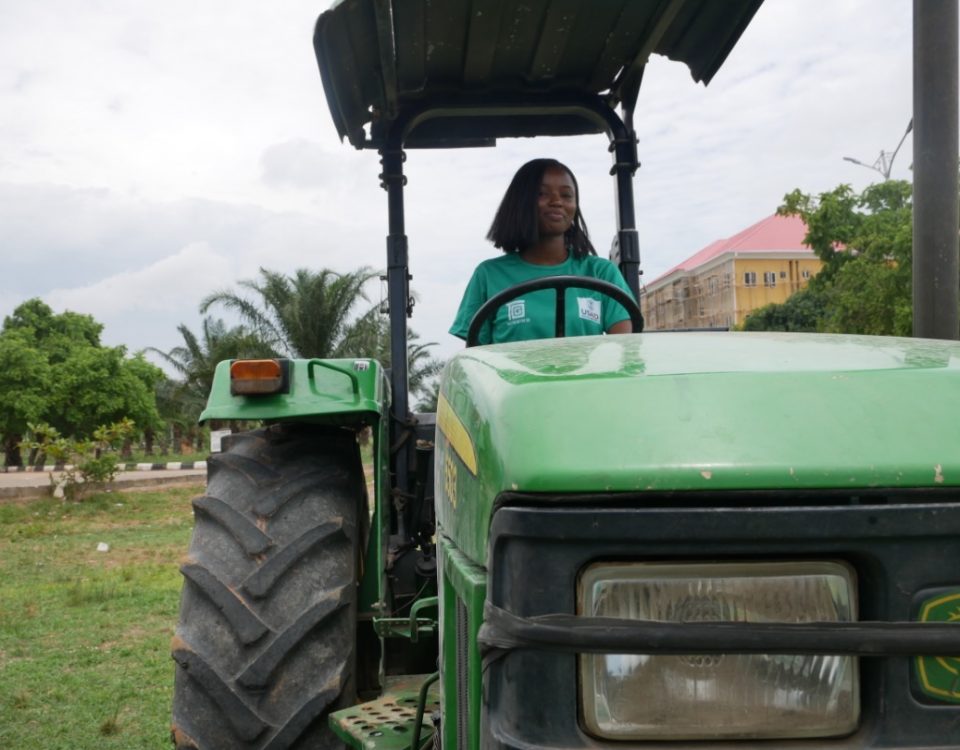 Woman driving a tractor